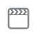Gray clapperboard icon with a film strip top edge on a white background