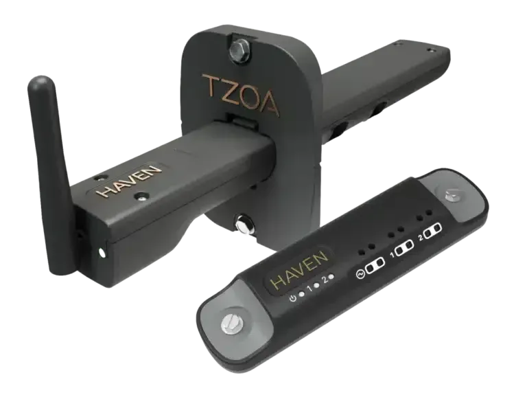 Black HAVEN/TZOA electronic device with antenna and detached module on white background