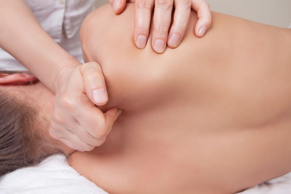 Person Receiving a Shoulder Massage — R & R Relaxation and Remedial In Yamba, NSW