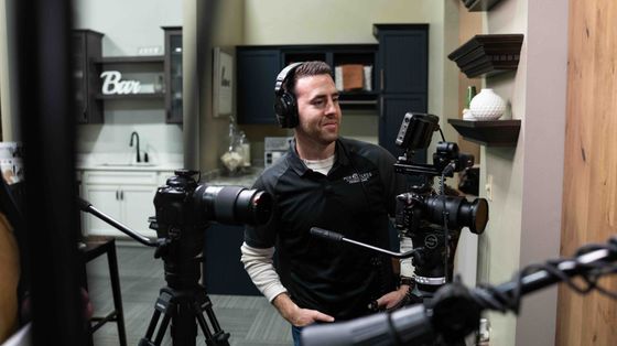 Founder Alex Belville on set directing professional commercial video production for a Wisconsin business.