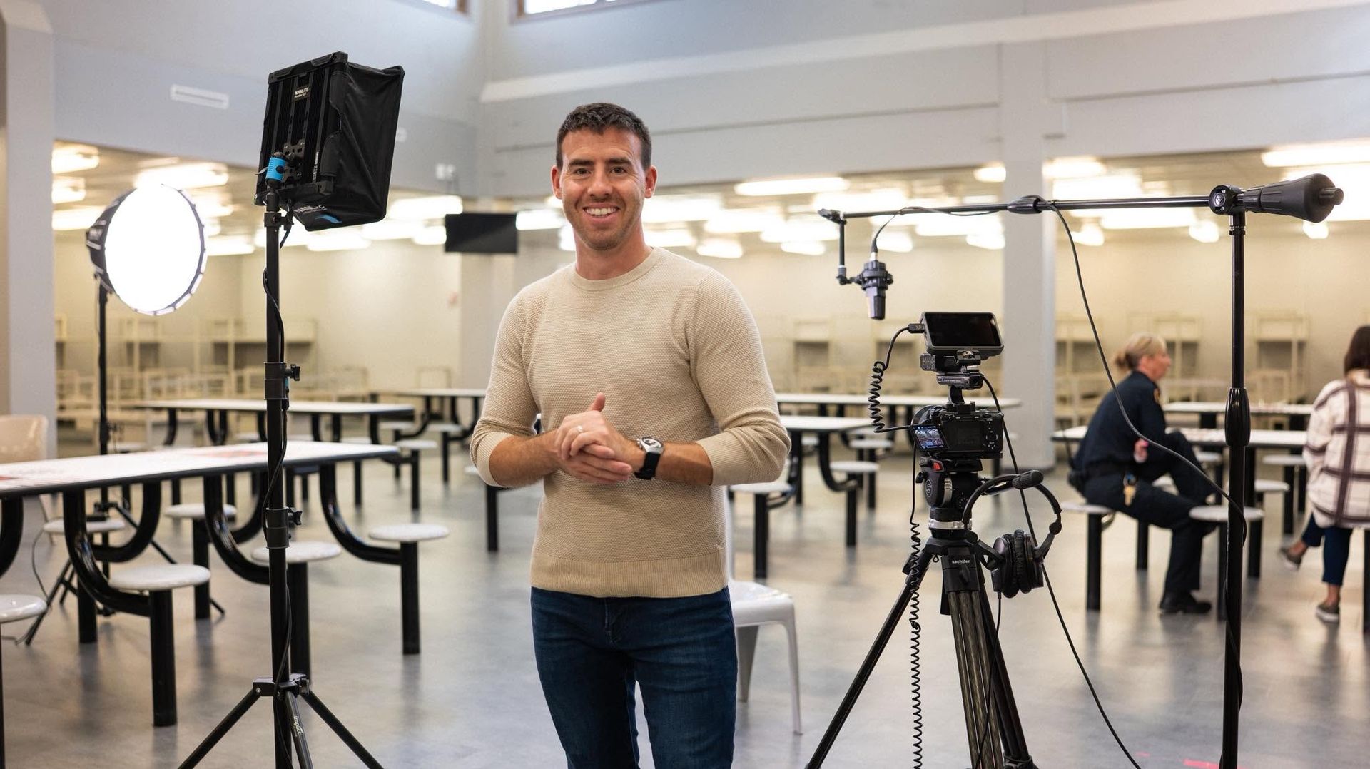 Founder Alex Belville preparing for professional video production at Solutions Recovery Club in Wisconsin.