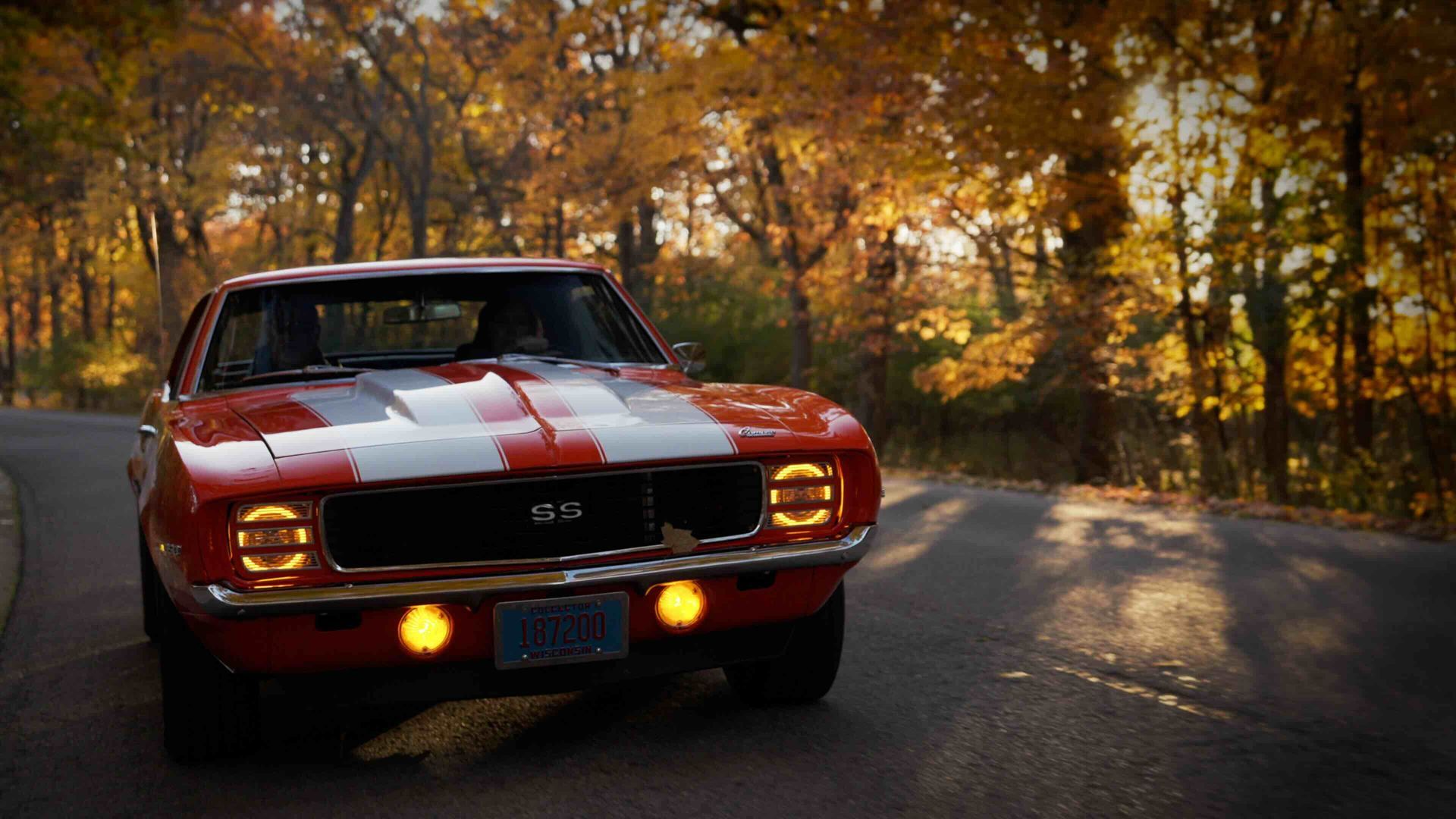 Cinematic commercial video production featuring a classic Chevrolet Camaro driving through Wisconsin in autumn.