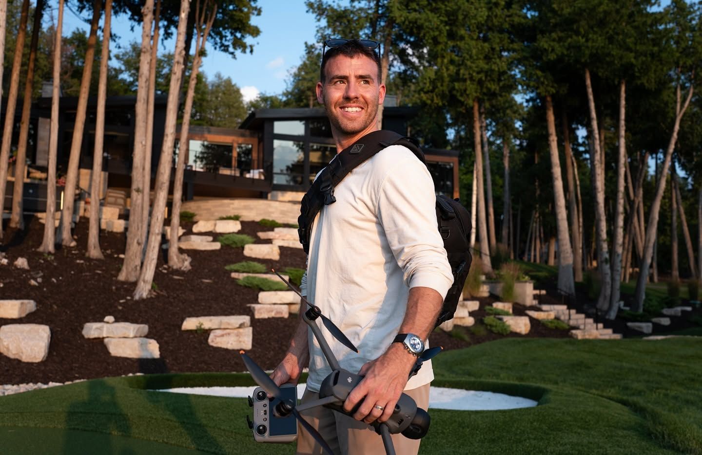 Filmmaker and drone pilot Alex Belville on location during a custom home video production for Burg Homes.