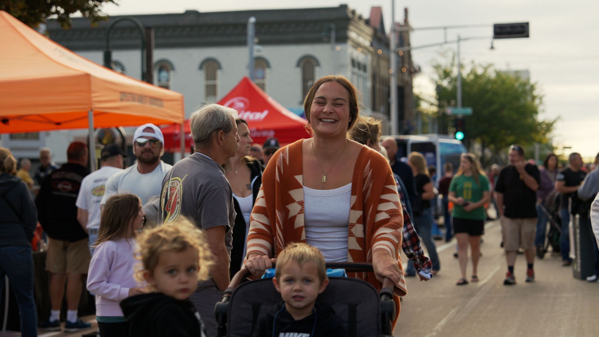 Family enjoying a community event in Wisconsin captured during tourism video production for Fox Cities CVB by Mirrorless Productions.