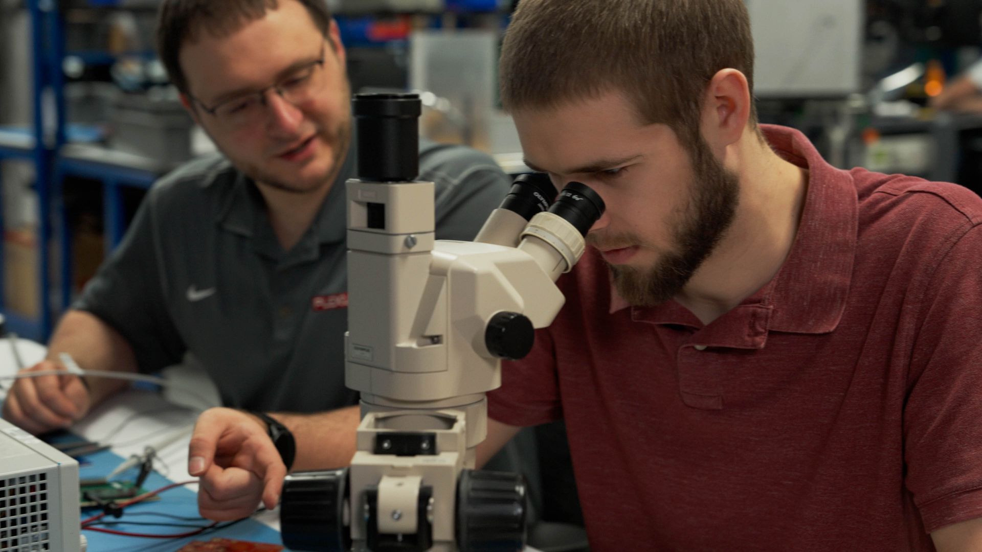 Plexus Corp. engineers and scientists working with laboratory equipment during advanced product development in Neenah, WI.