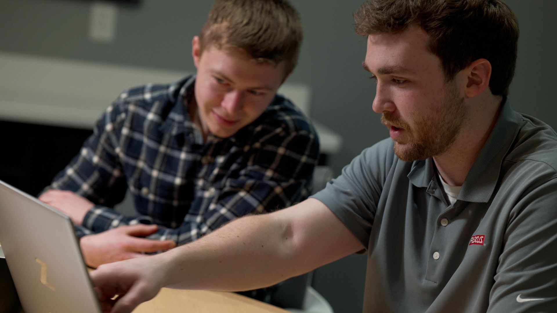 Plexus engineering team collaborating during a corporate video production showcasing innovation and product development.