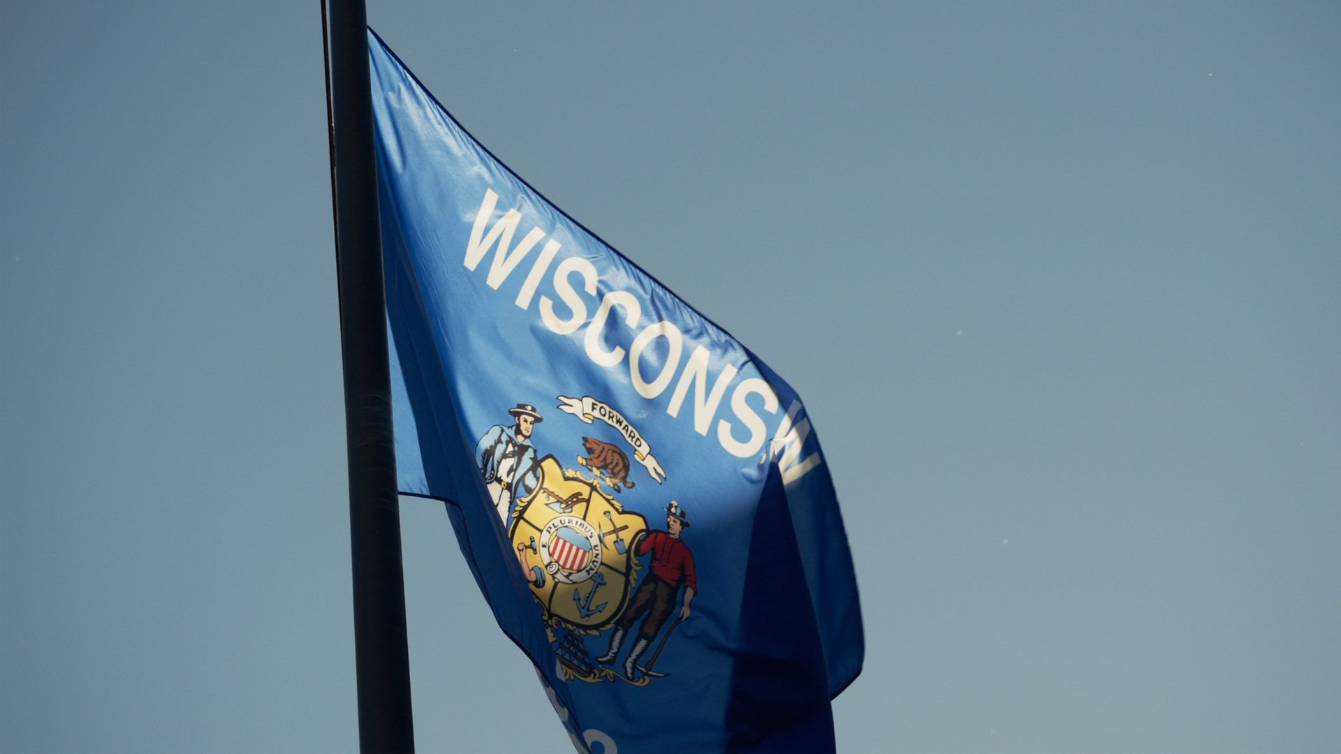 Wisconsin state flag representing locally produced commercial video production and visual storytelling.