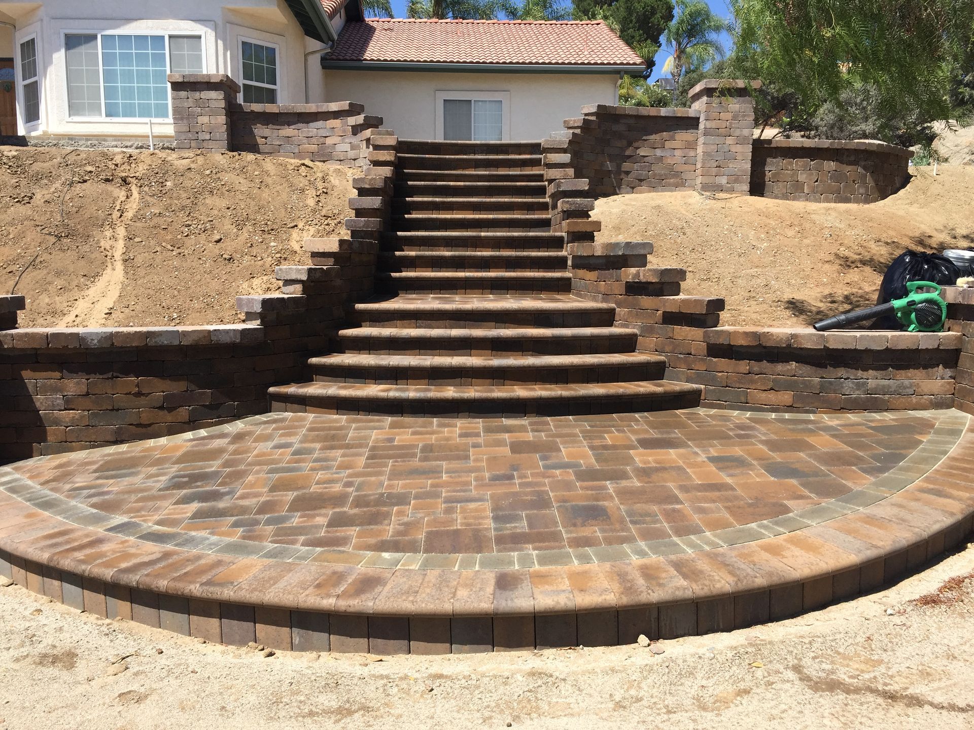 Paver stairs in landscaped San Diego backyard with custom hardscaping