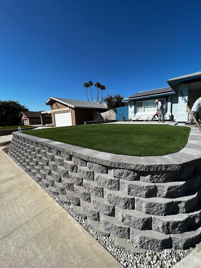 San Diego artificial turf yard with custom retaining wall installation