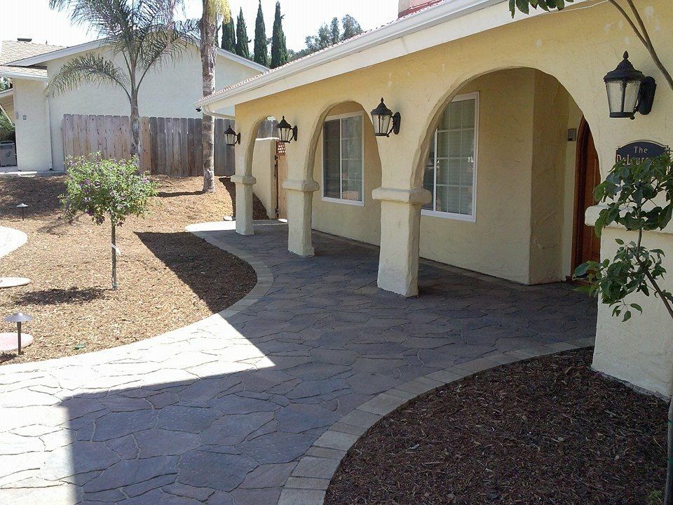 Decorative stamped concrete pathway installed by concrete contractors in San Diego