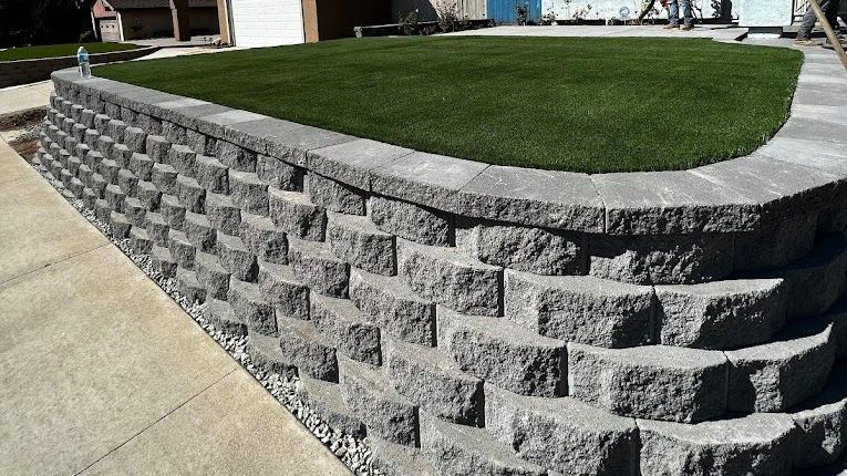 artificial turf backyard designed to stay cooler with shade and balanced landscaping in san diego
