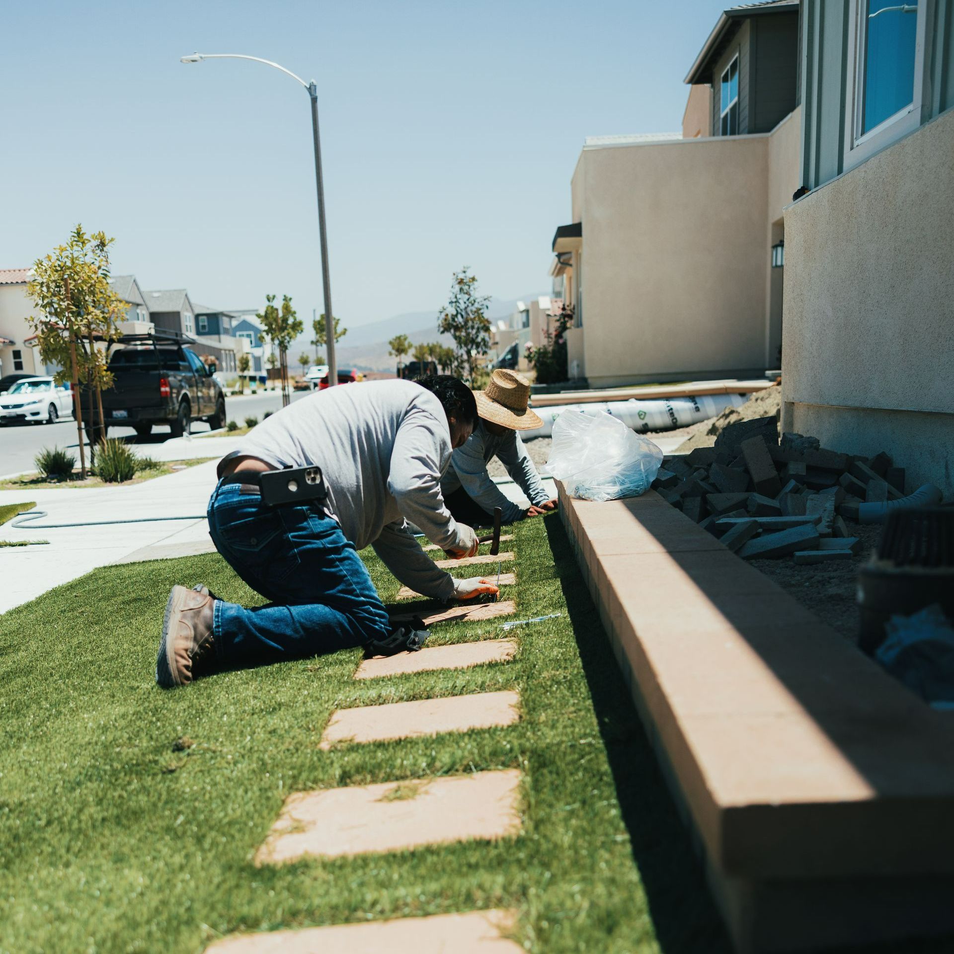 San Diego landscapers installing artificial turf in residential landscape project.