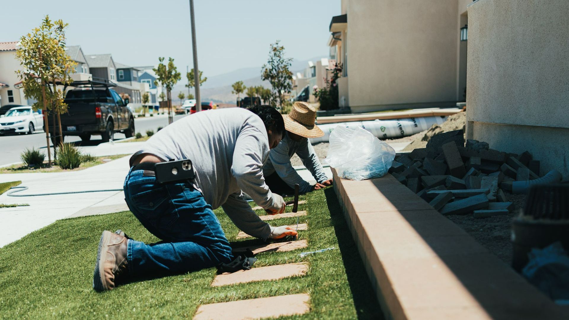 San Diego landscapers installing artificial turf in residential front yard