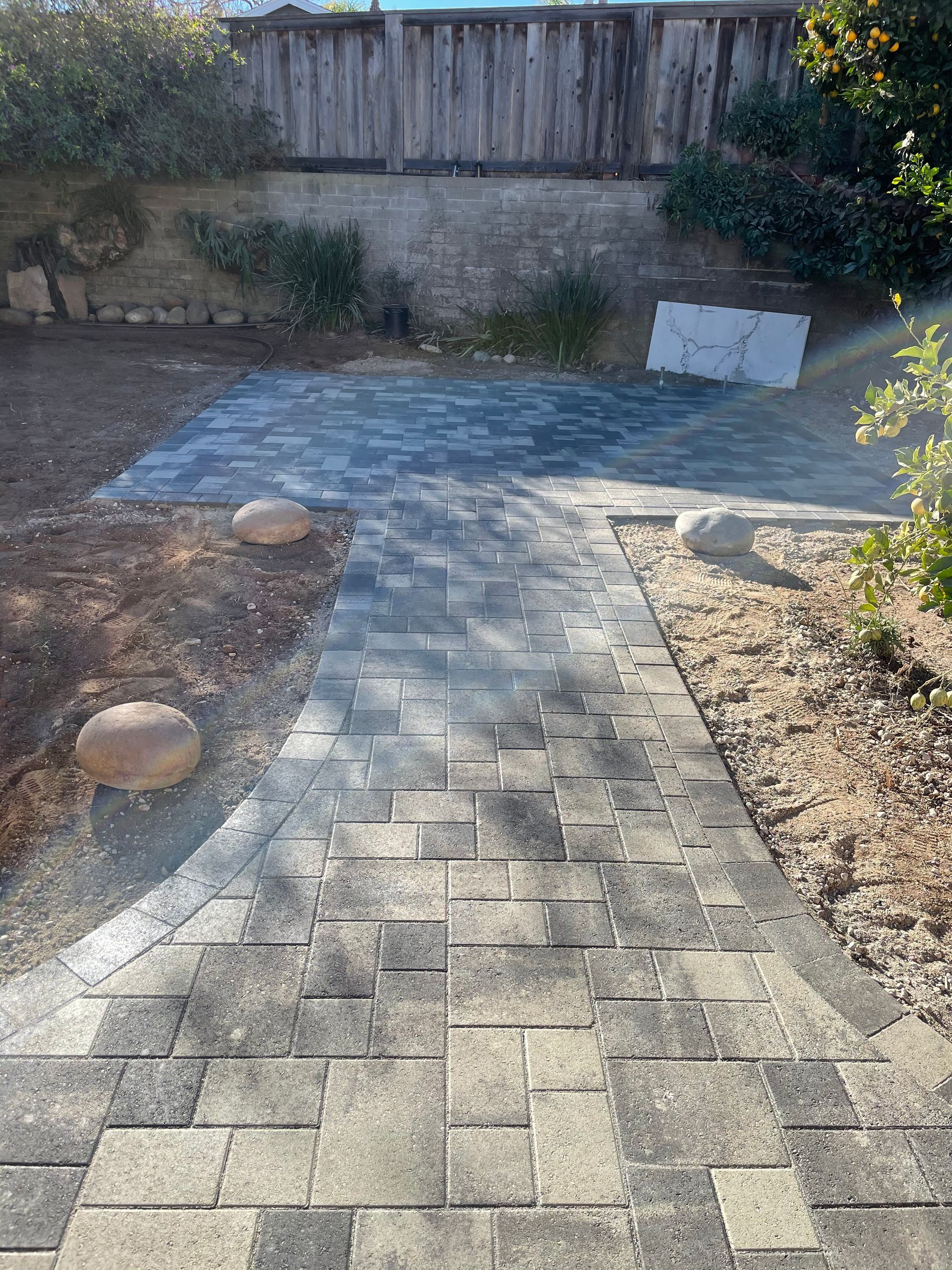 Curved paver walkway designed by San Diego landscape professionals