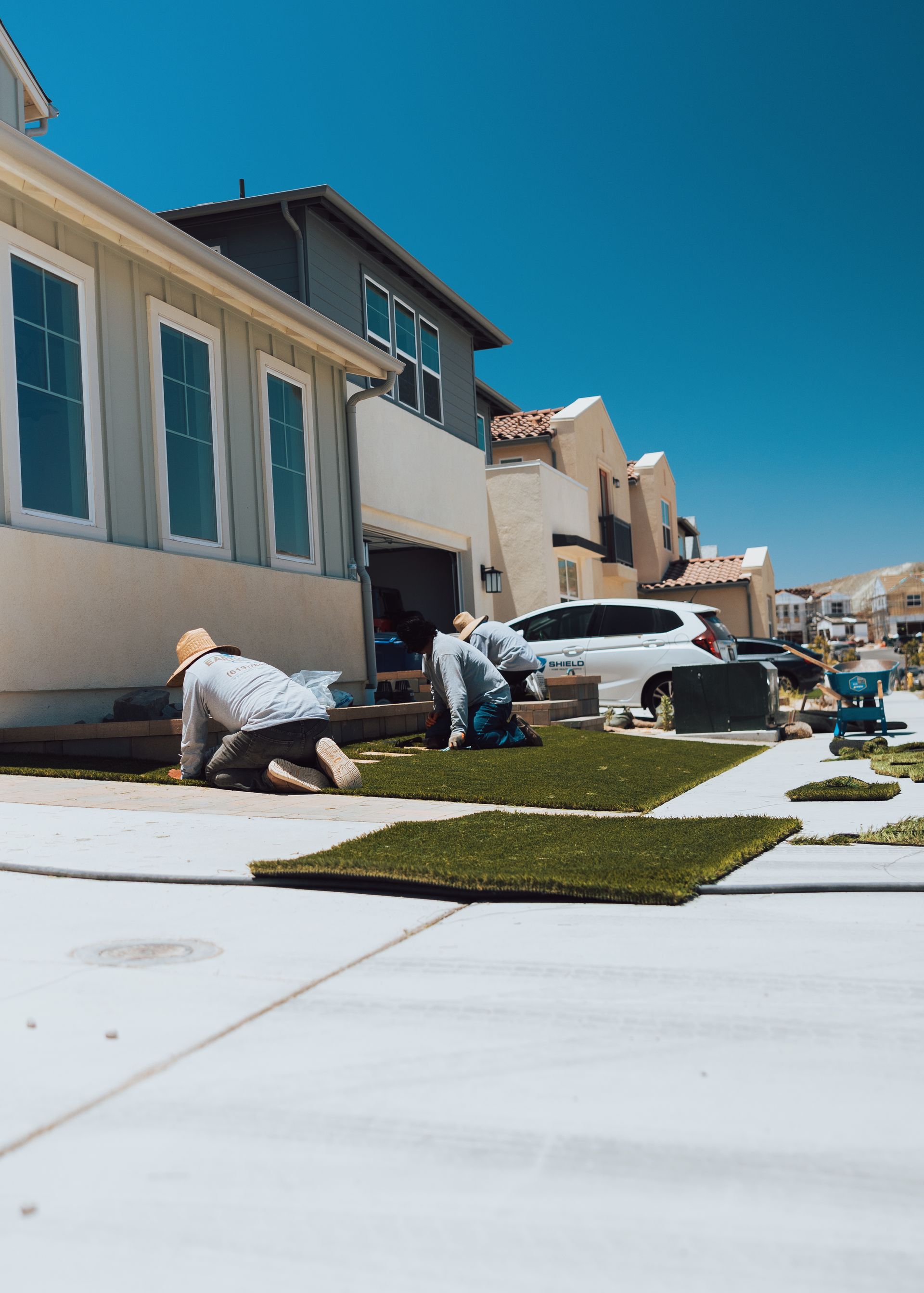 San Diego landscape team installing turf for residential project