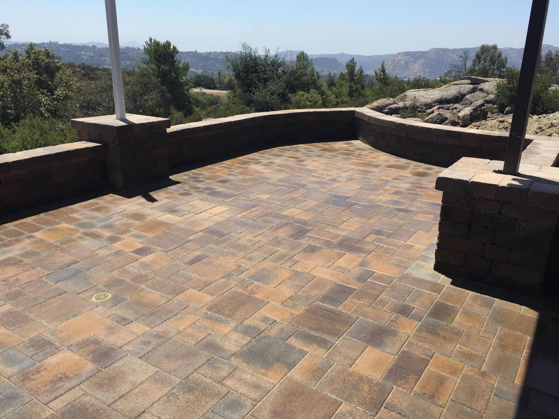 Tall backyard retaining wall built by San Diego landscape and hardscape specialists
