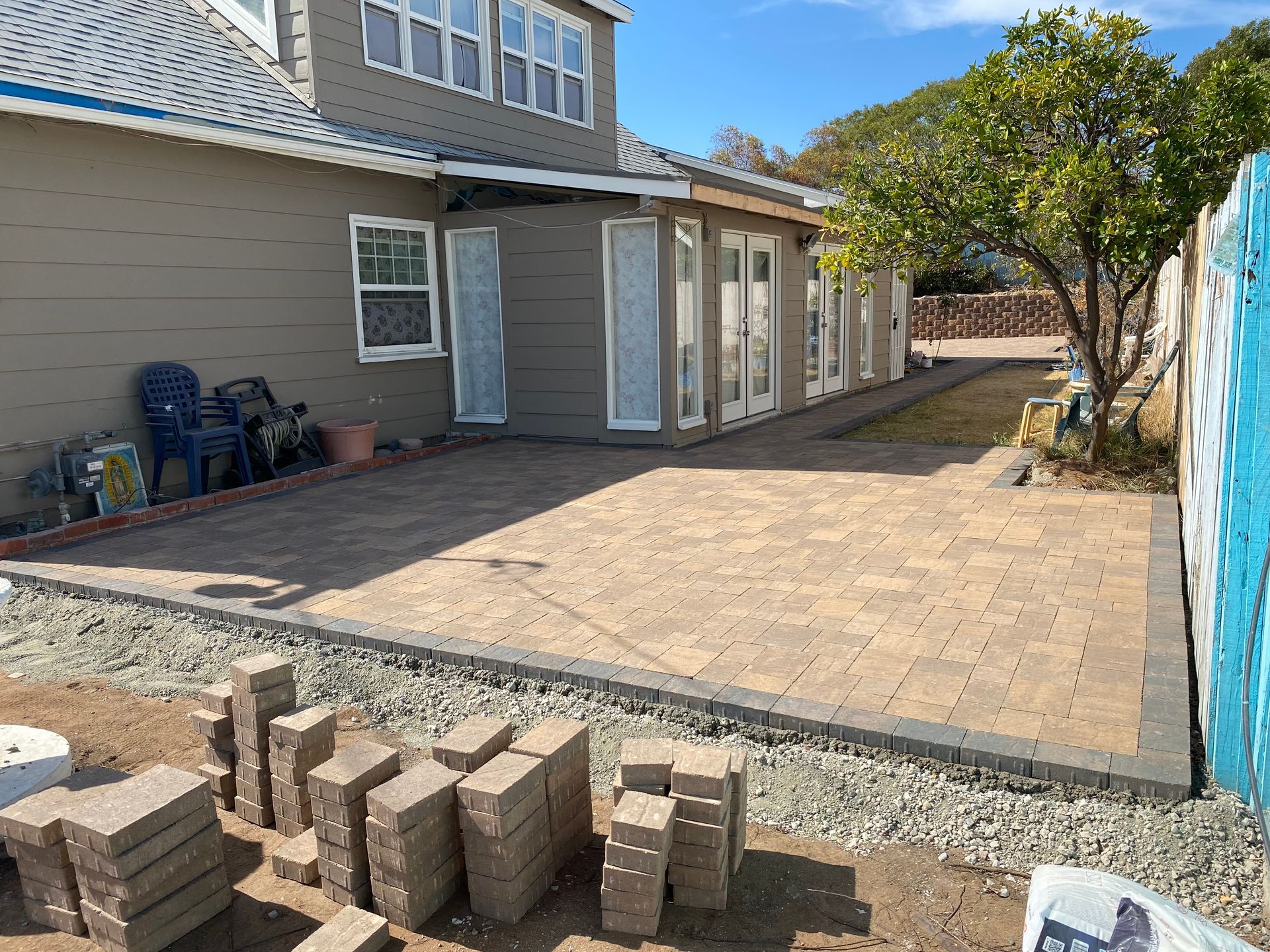 San Diego landscapers working on backyard paving and patio installation