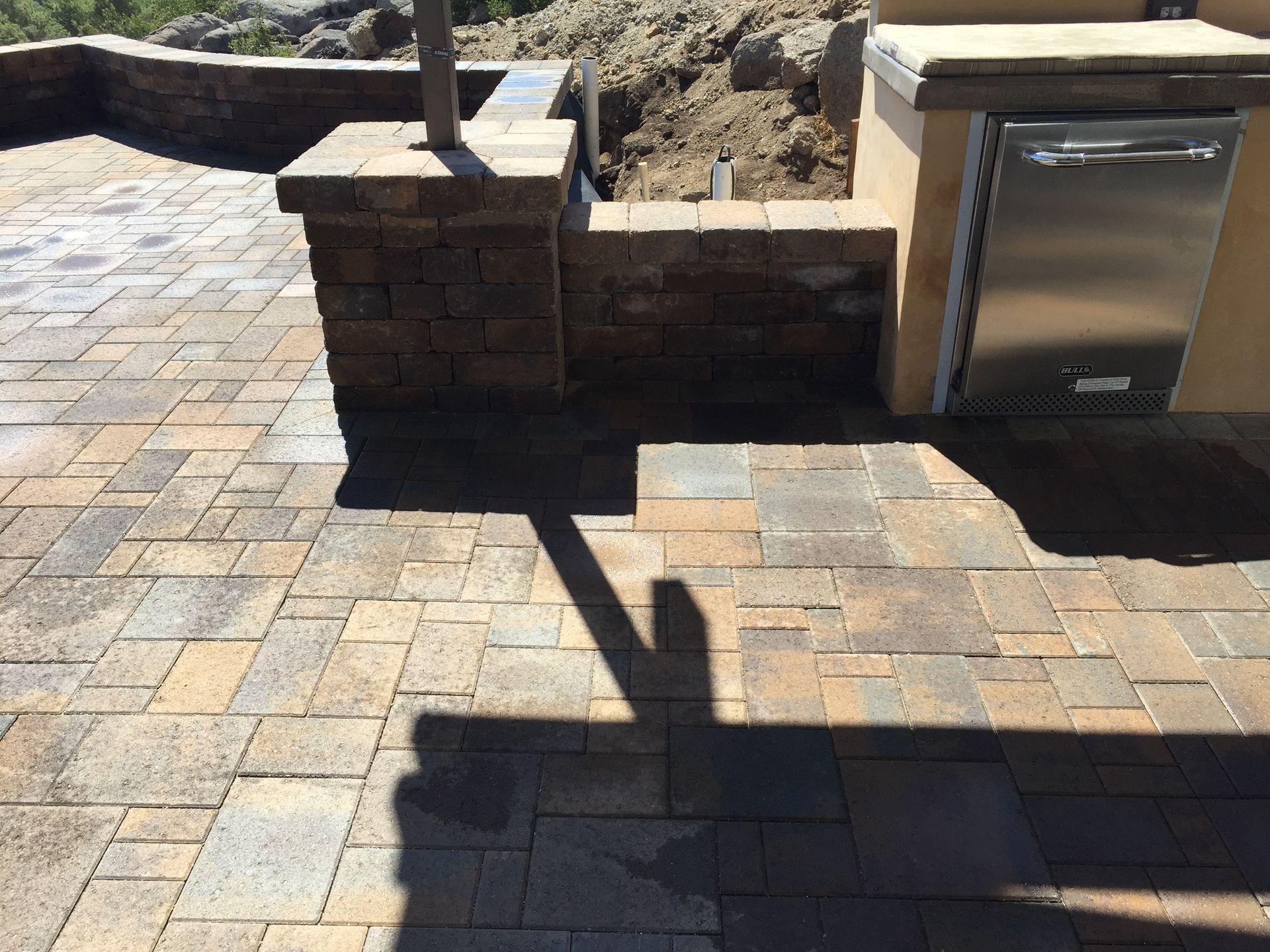 Custom outdoor kitchen install with BBQ island and prep space in Lincoln Acres