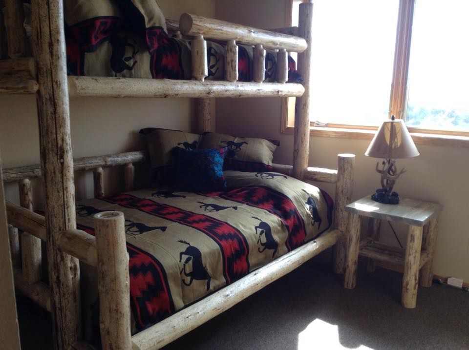 wooden bed frame beside window