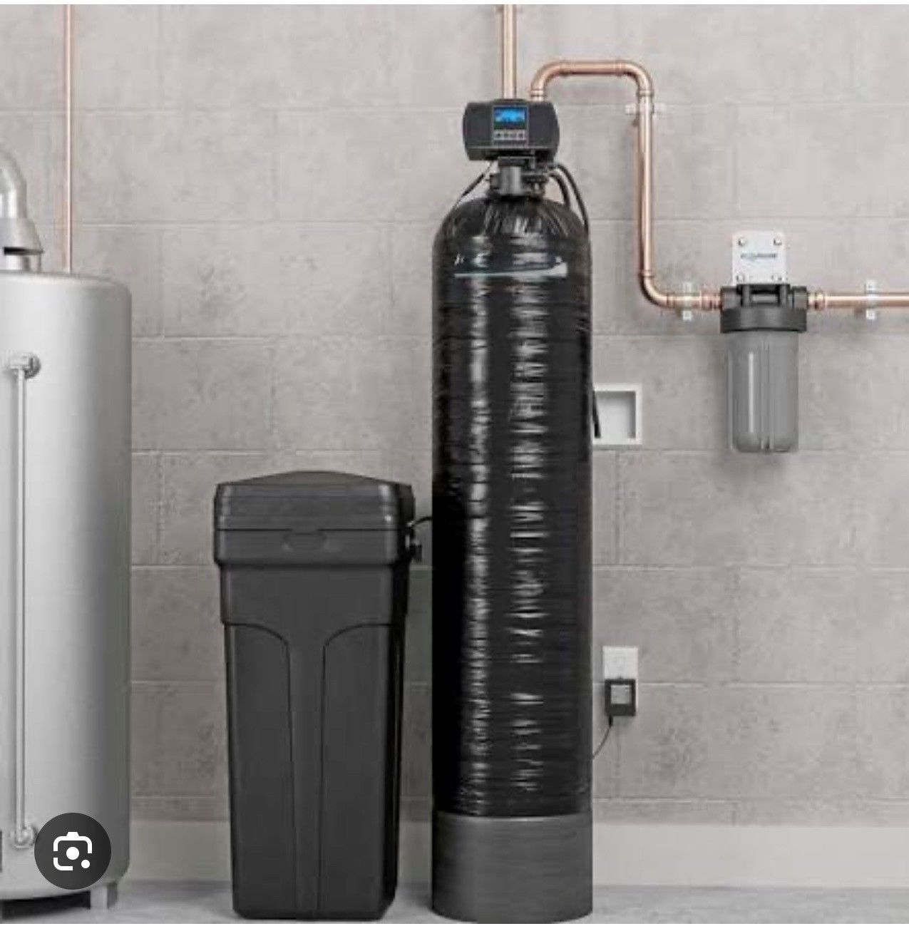 Water softener system with black tank, control head, salt bin, and filter unit in a tiled utility room