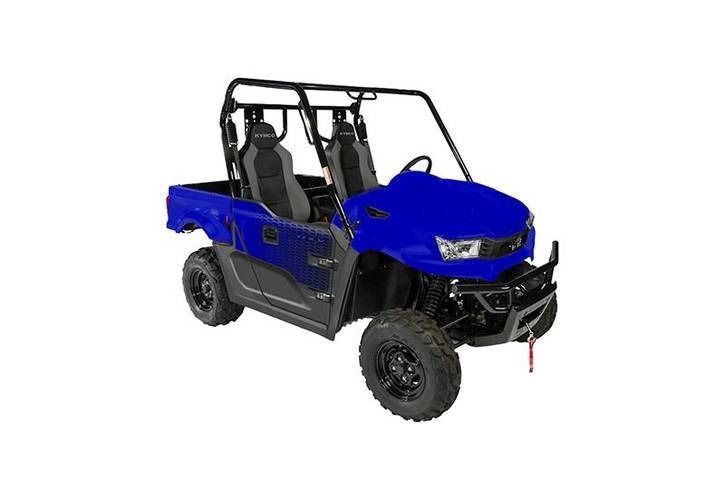 Blue side-by-side UTV with roll cage and black wheels, parked outdoors.