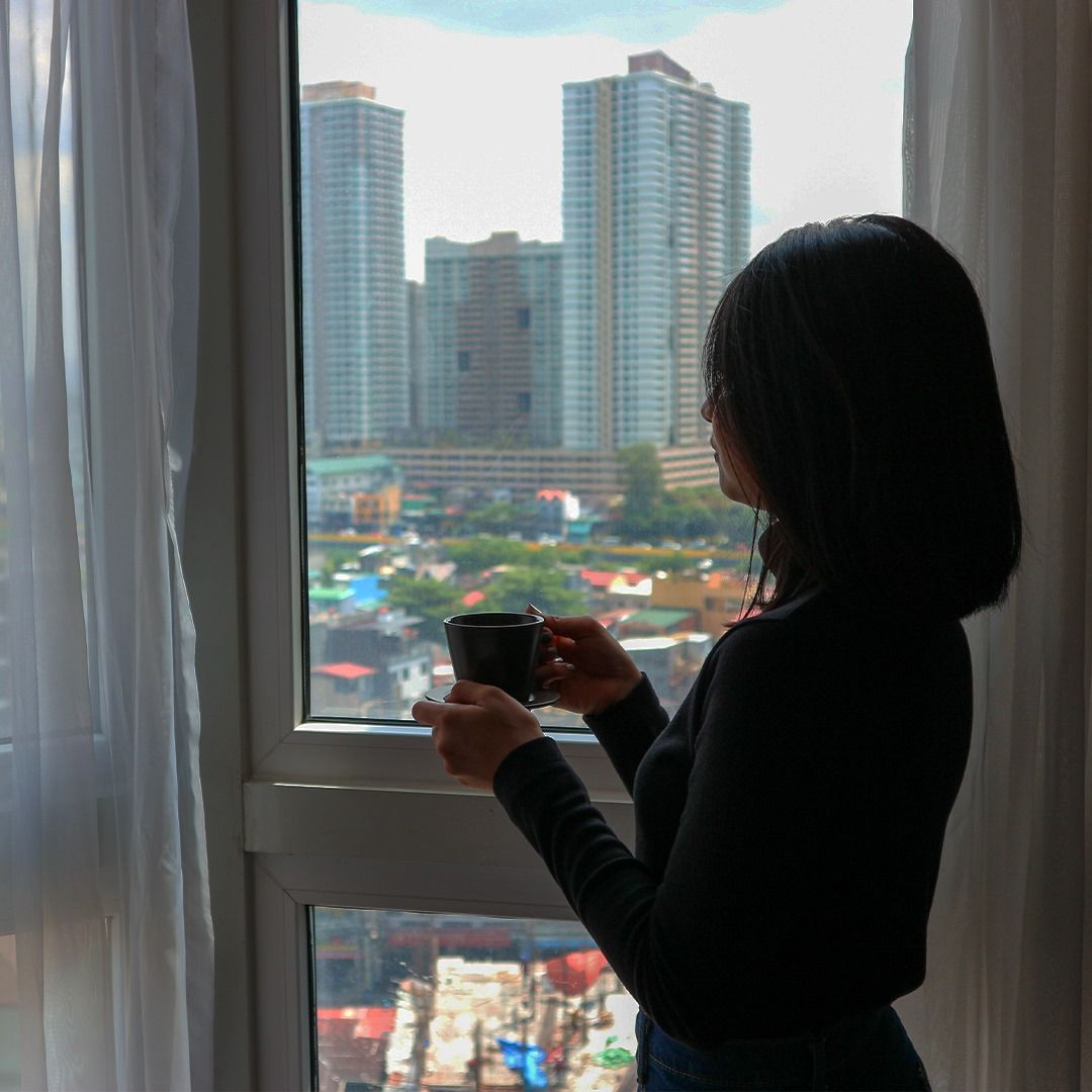 Extended stay guest with Makati skyline view at Y2 Residence Hotel, Poblacion Makati