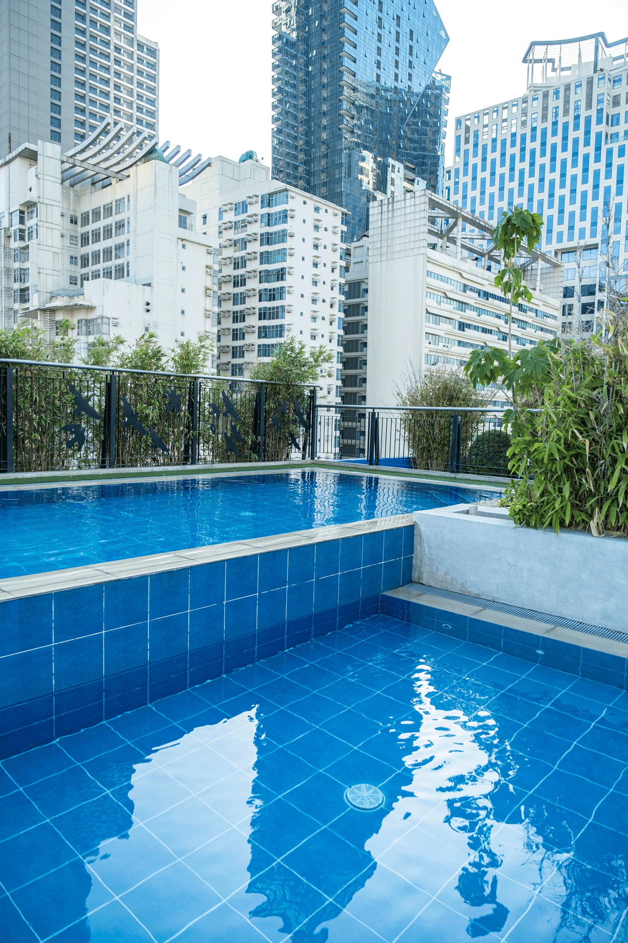 Rooftop pool with Makati skyline views at Y2 Residence Hotel, Poblacion Makati