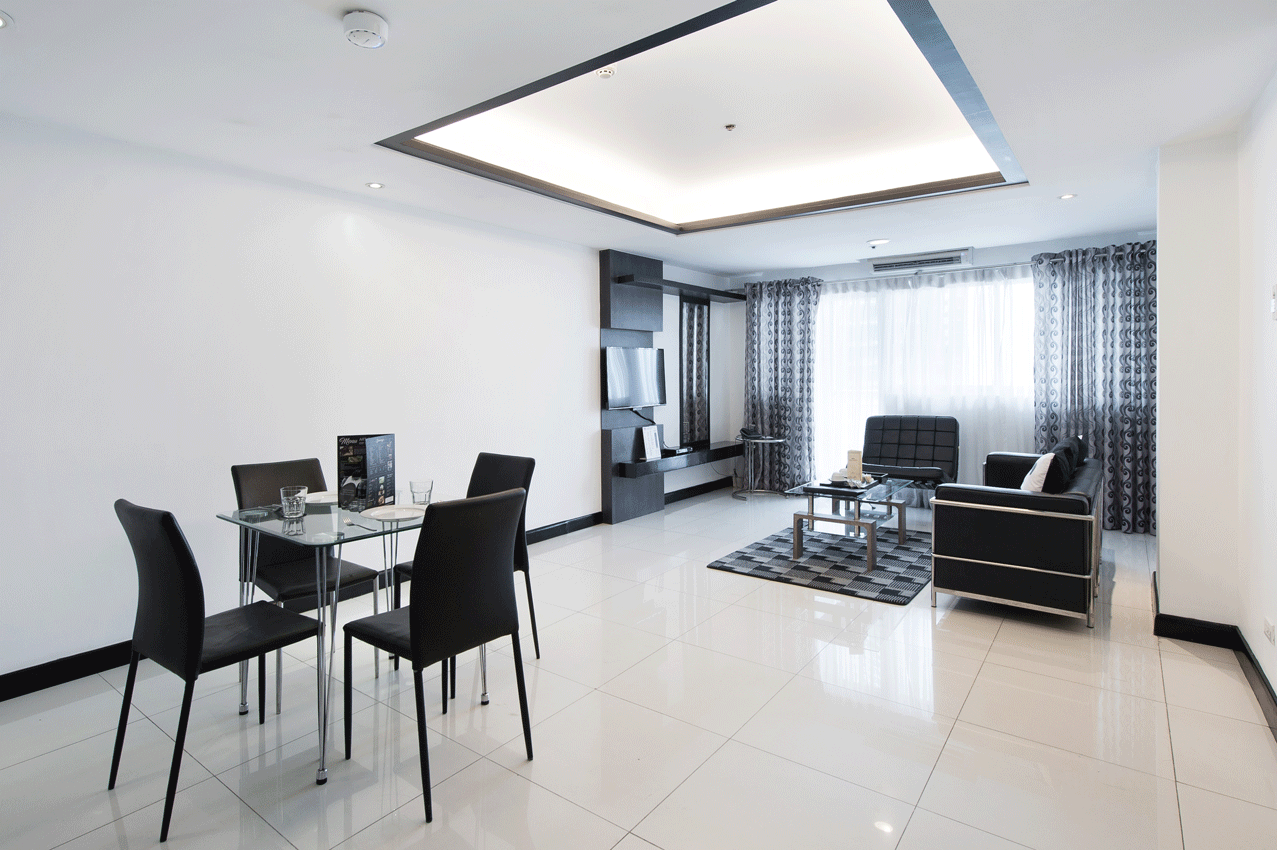 Living and dining area in a Two Bedroom Premier at Y2 Residence Hotel, Poblacion Makati