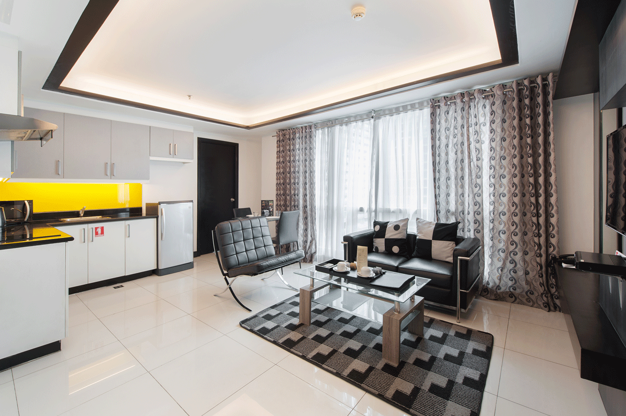 Spacious living area with modern furnishings at family staycation makati location.
