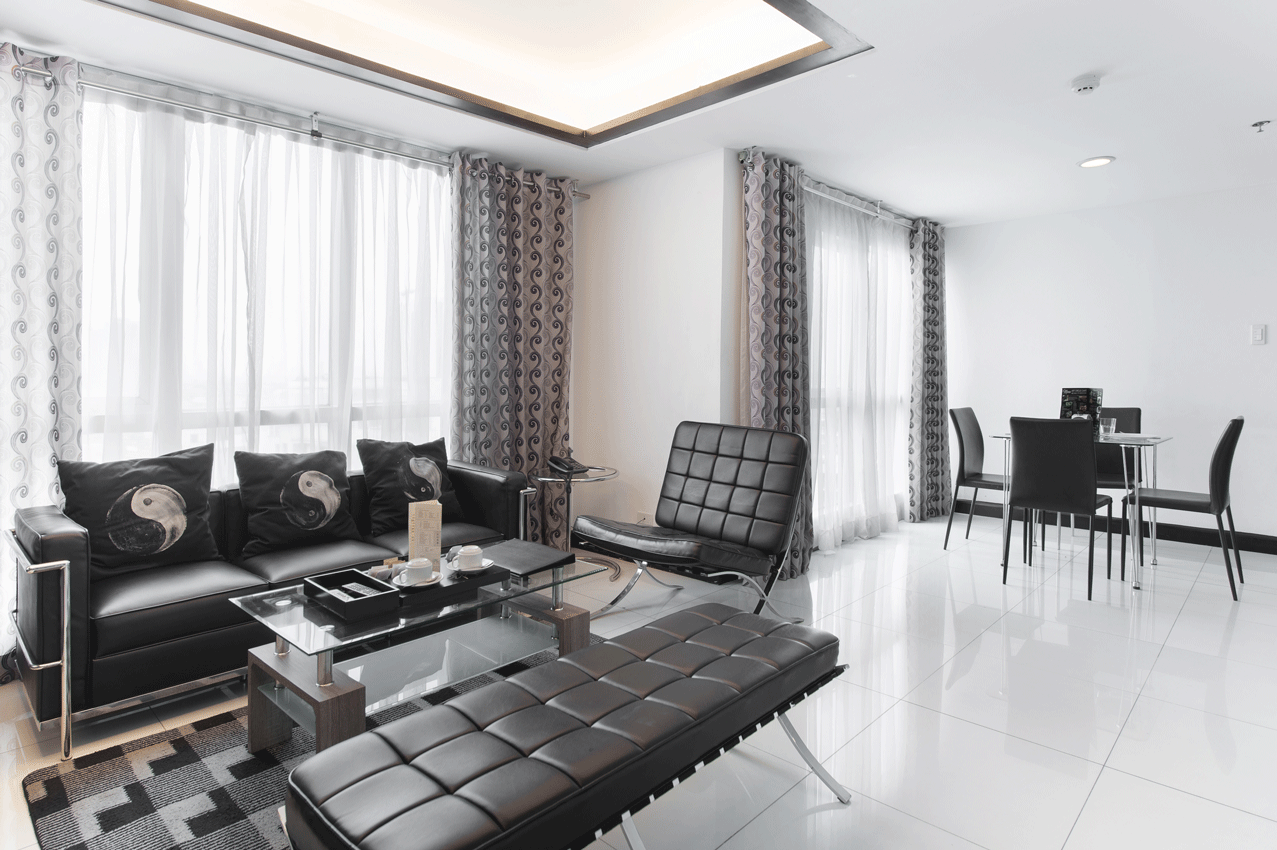 Feel at home at Y2's accommodation with a couch , chairs , table and curtains.