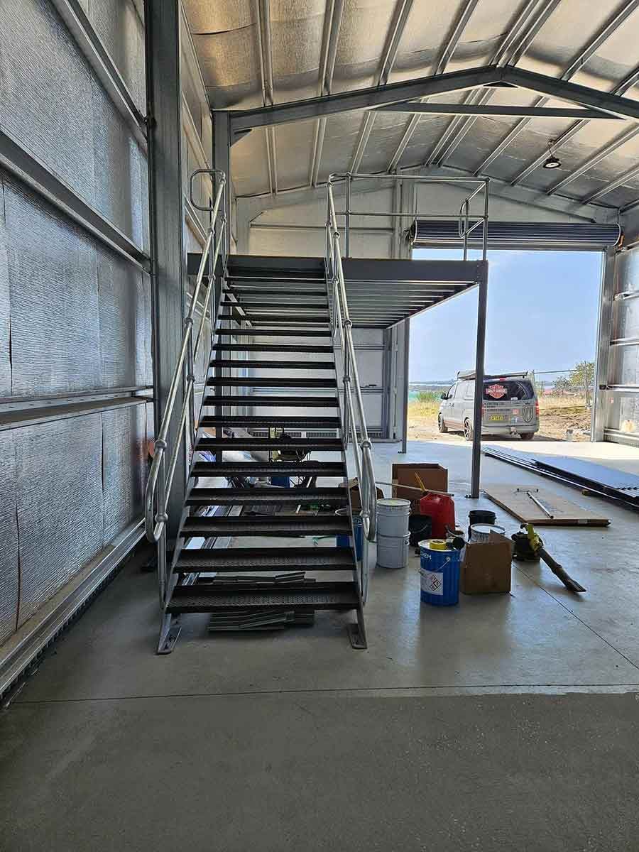 A Metal Staircase Leading Up to a Second Floor in a Building — SCF Industries Pty Ltd in Albion Park Rail, NSW