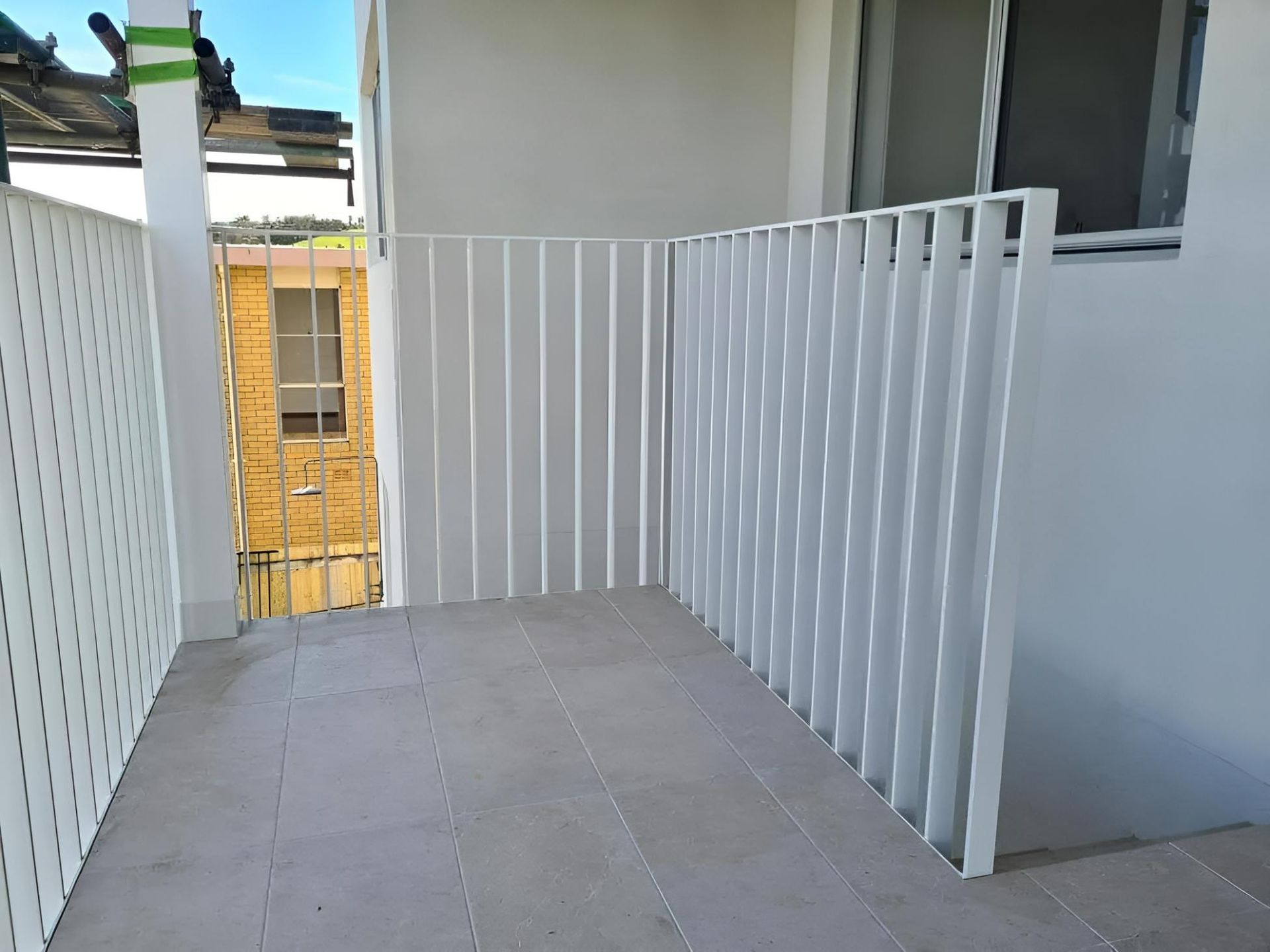 A Balcony With a White Railing and a Window — SCF Industries Pty Ltd in Albion Park Rail, NSW
