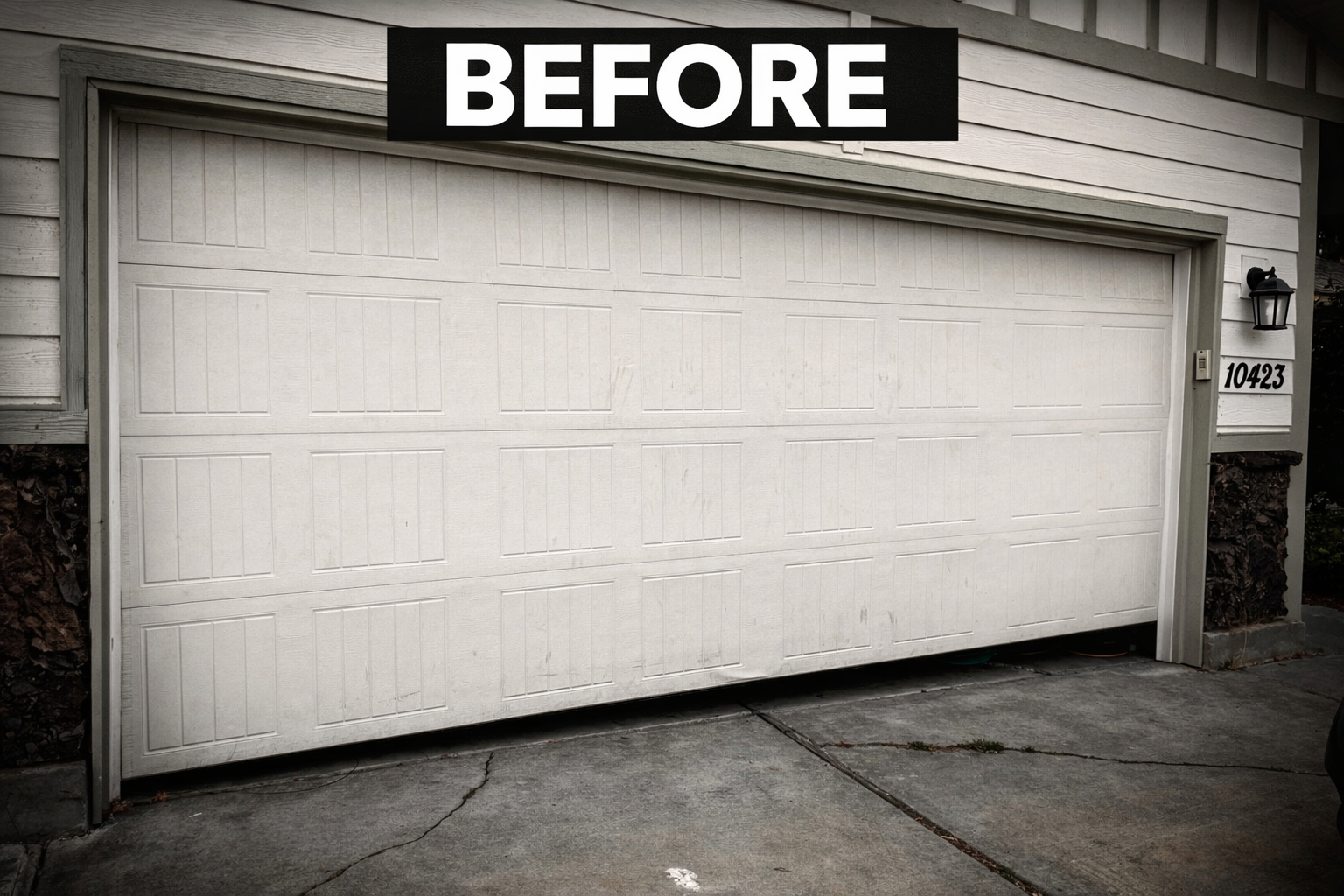 White garage door labeled “BEFORE” on a house exterior, viewed from the driveway.