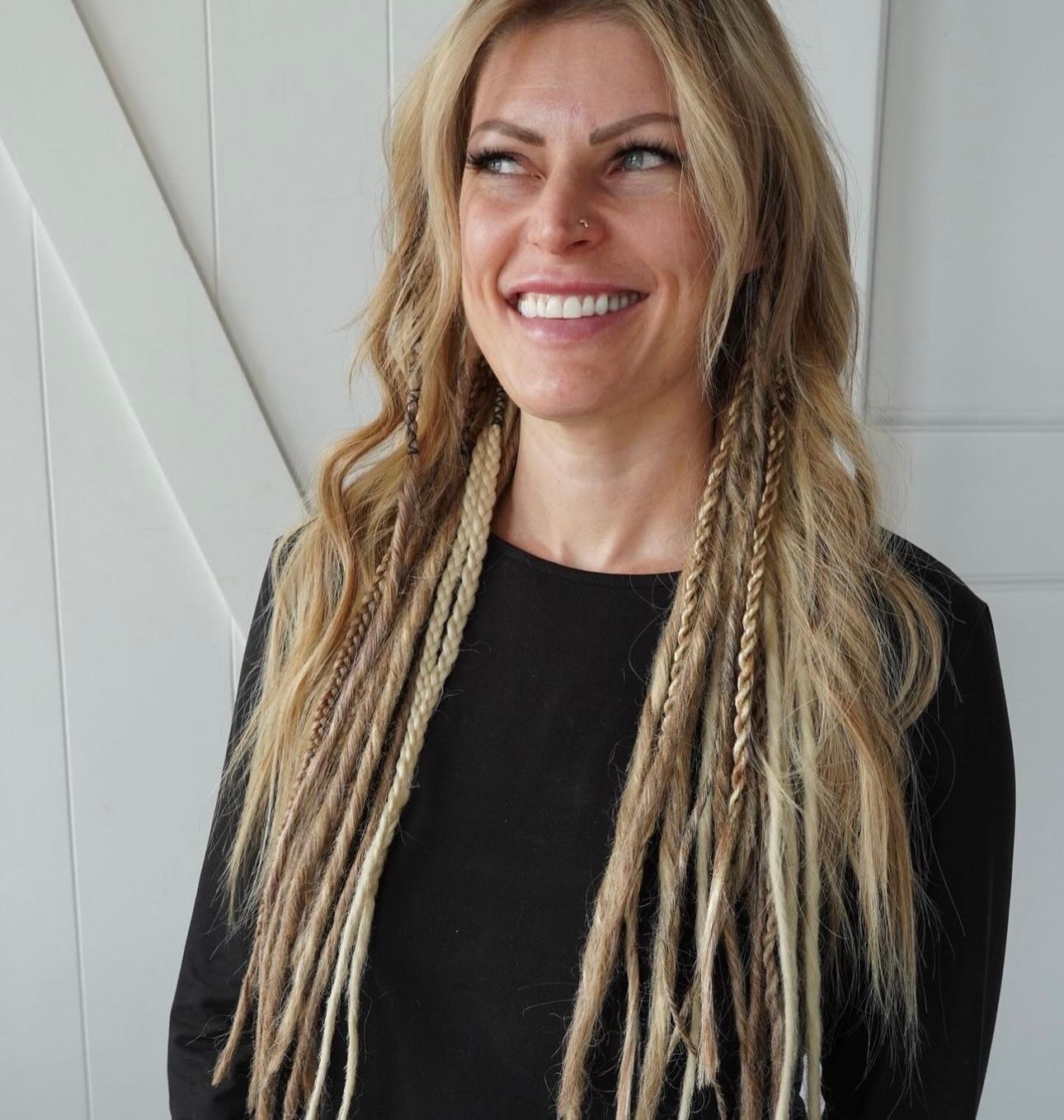 smiling woman with synthetic dreadlocks