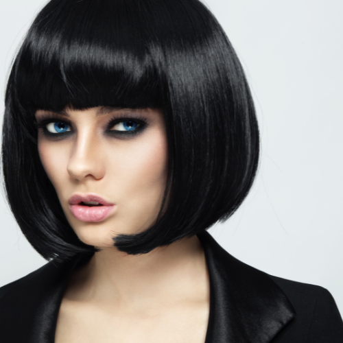 woman with dark hair and bangs