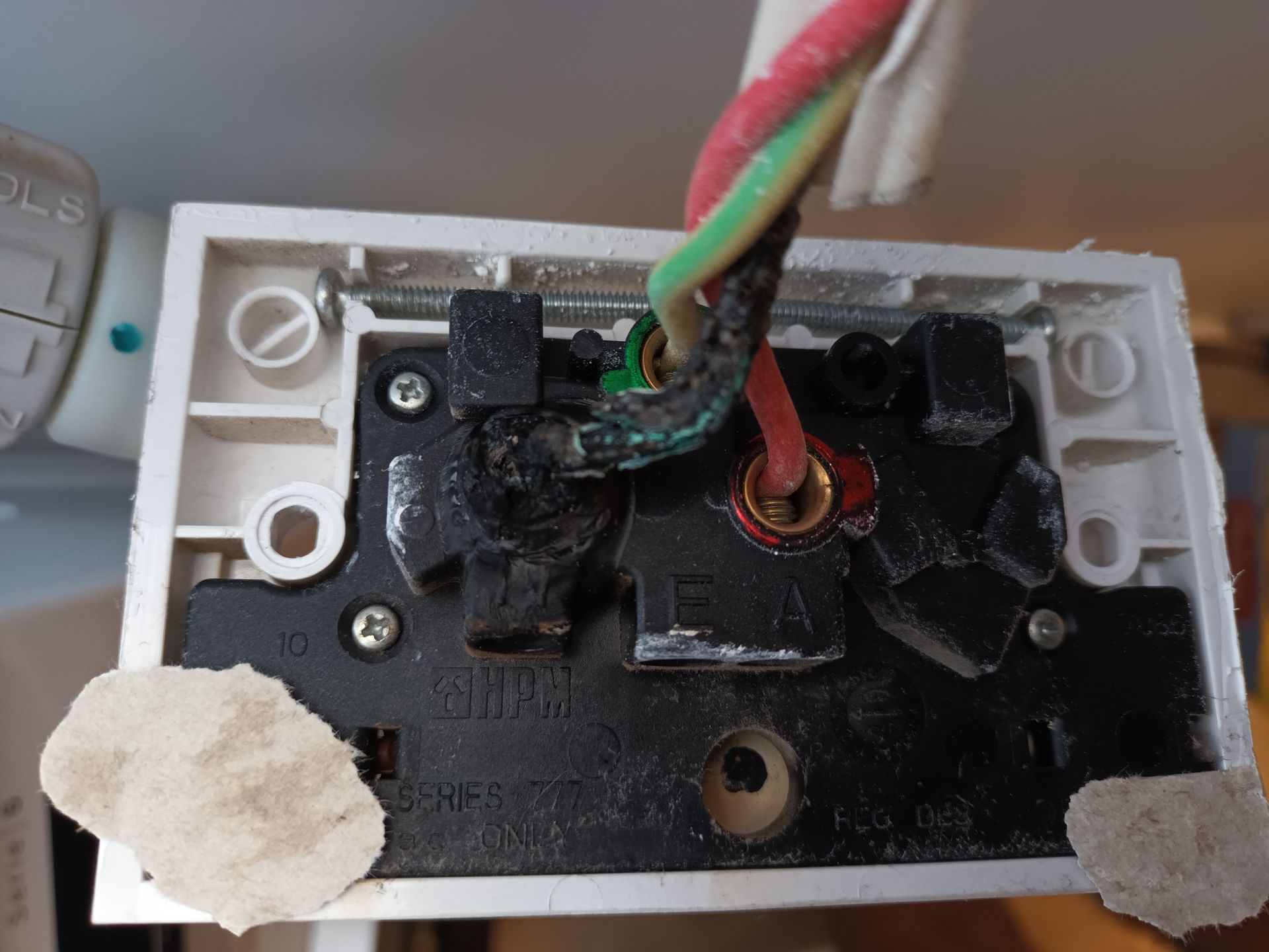 Damaged electrical outlet with charred wires; red, green, and black. — Ryphen Electrical in Highton, VIC