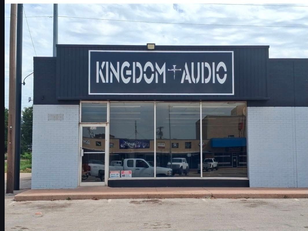 Storefront with a large “KINGDOM AUDIO” sign above the windows.