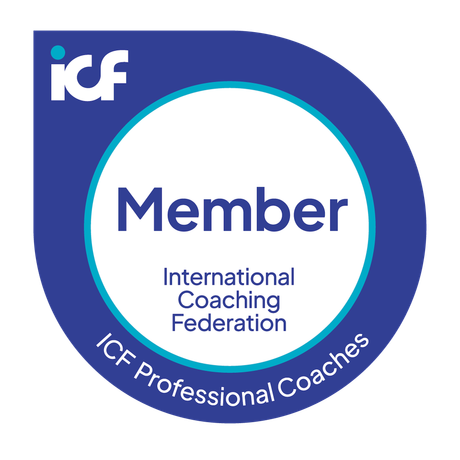 A blue and white badge for the International Coaching Federation identifying the holder as an ICF Professional Coach member.