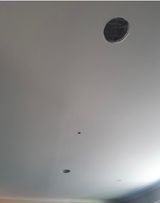 This is a before picture of the down light holes we had to fix in a ceiling in Golden Square 