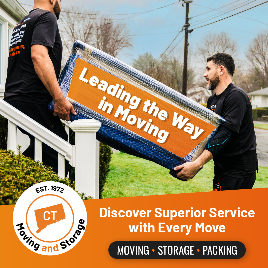 Two movers carrying a wrapped item labeled