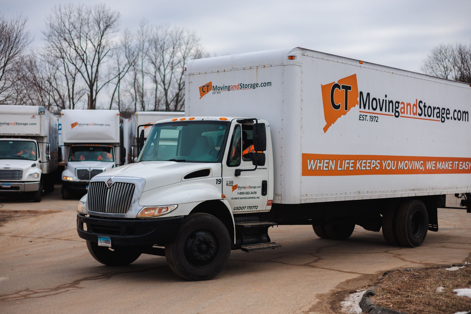 White moving truck with orange logo