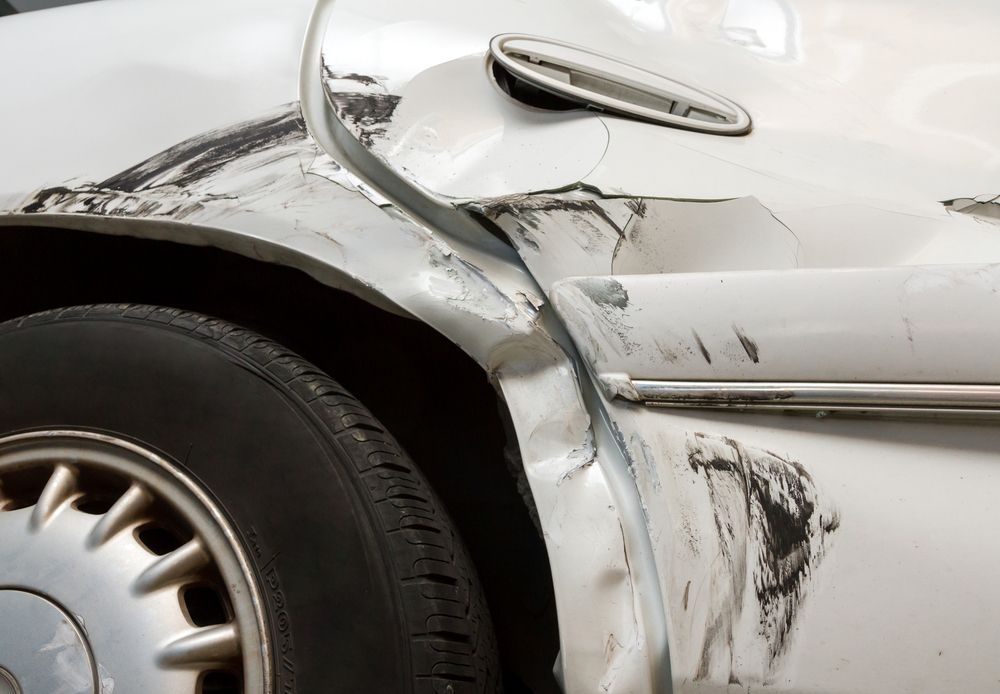 A Close Up of Tyre on Car with Damage — East Coast Panel & Paint In Woolgoolga, NSW