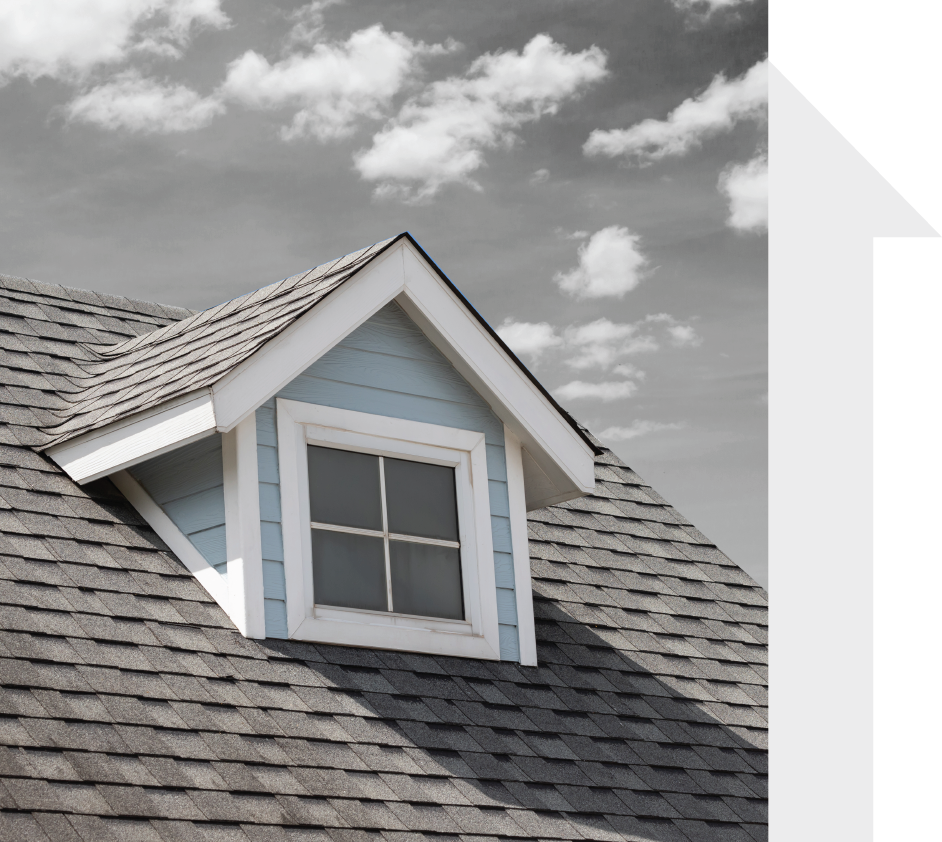 The roof of a house has a small window on it