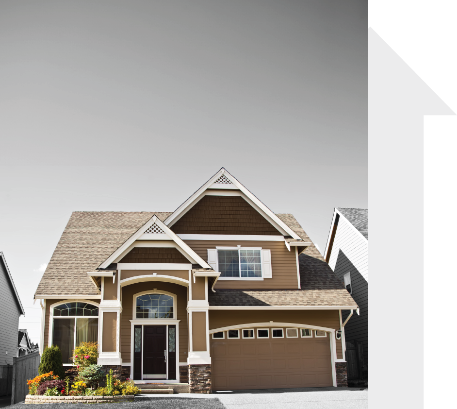 A brown and white house with a large garage door