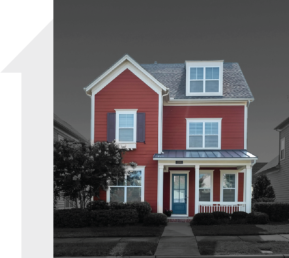 A red house with white trim and a blue door
