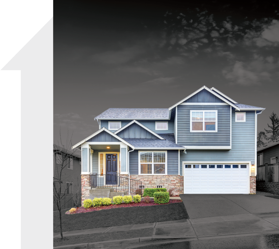 A large blue house with a white garage door