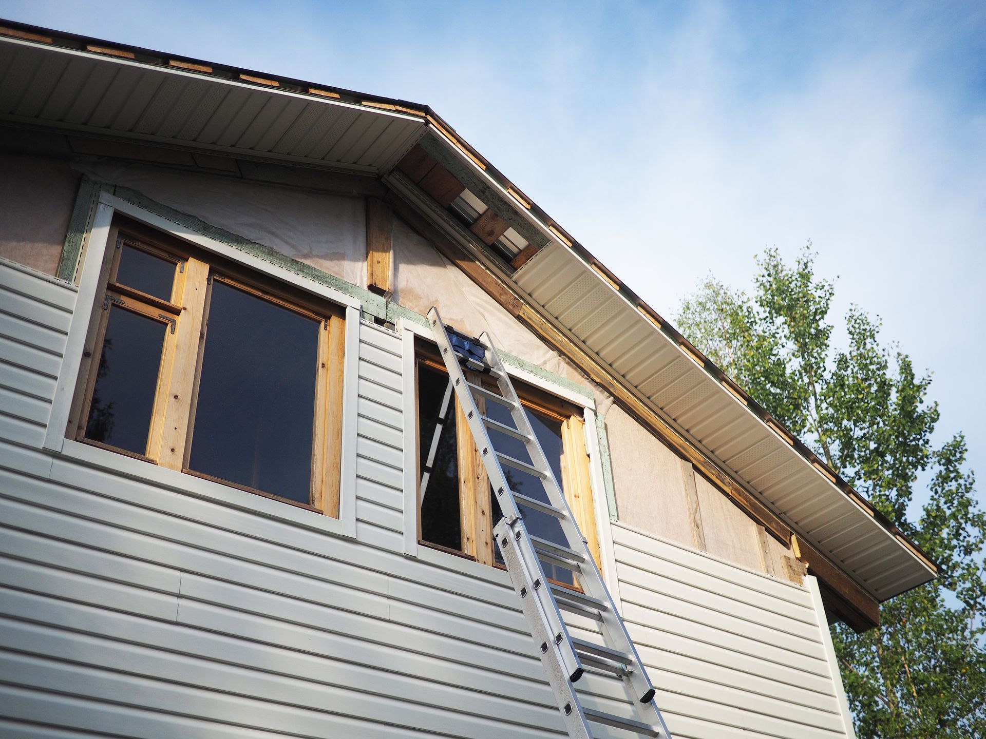 A house with their siding being redone.