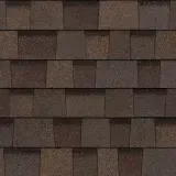 A close up of a row of brown shingles on a roof.