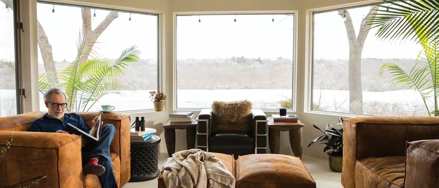 A sunroom with newly installed bay windows.