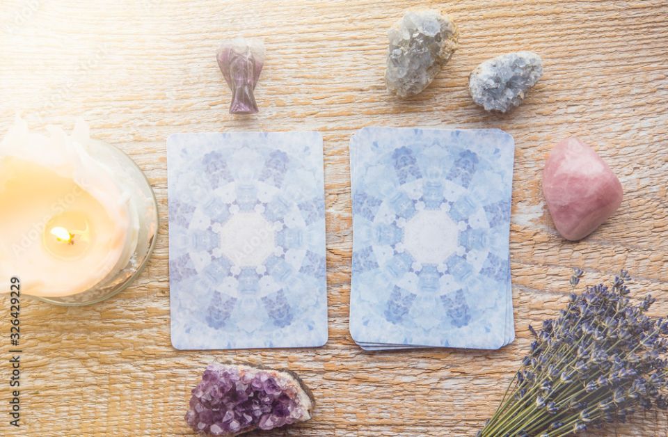 deck of tarot cards on a wooden table